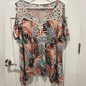 Woman’s plus size cold shoulder top